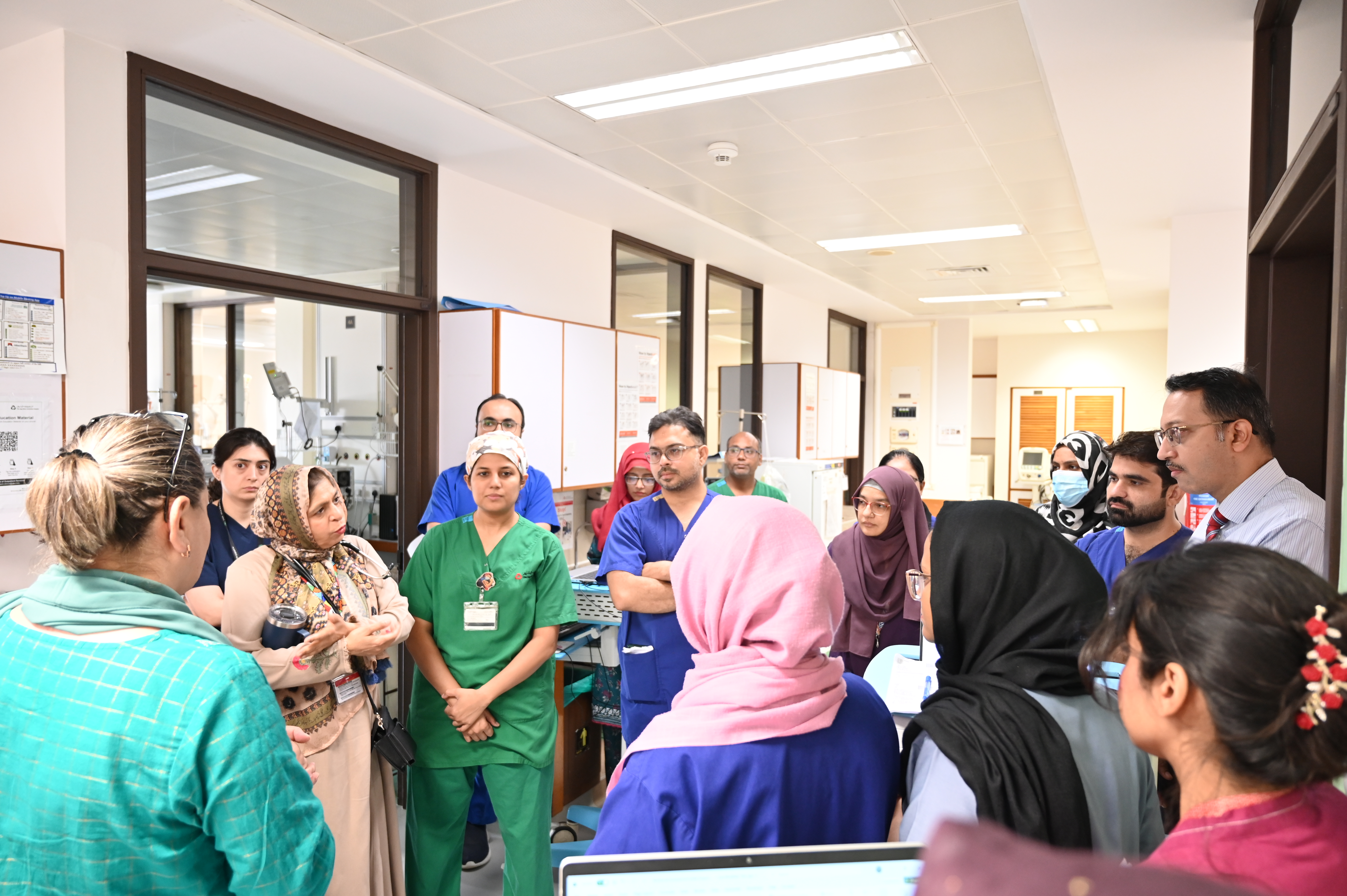 Clinicians gather on the unit for a briefing