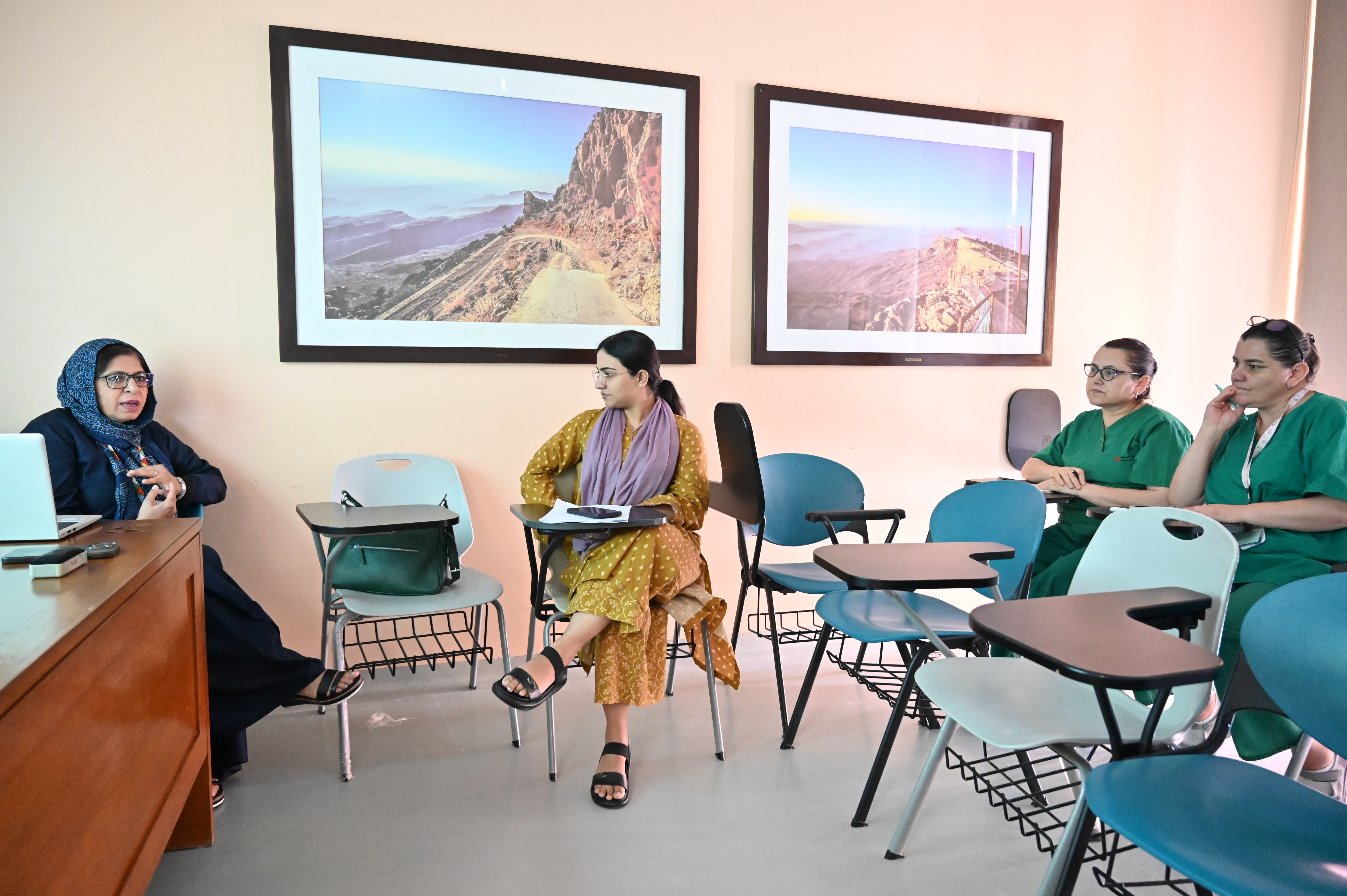 A seminar with guests seated in front