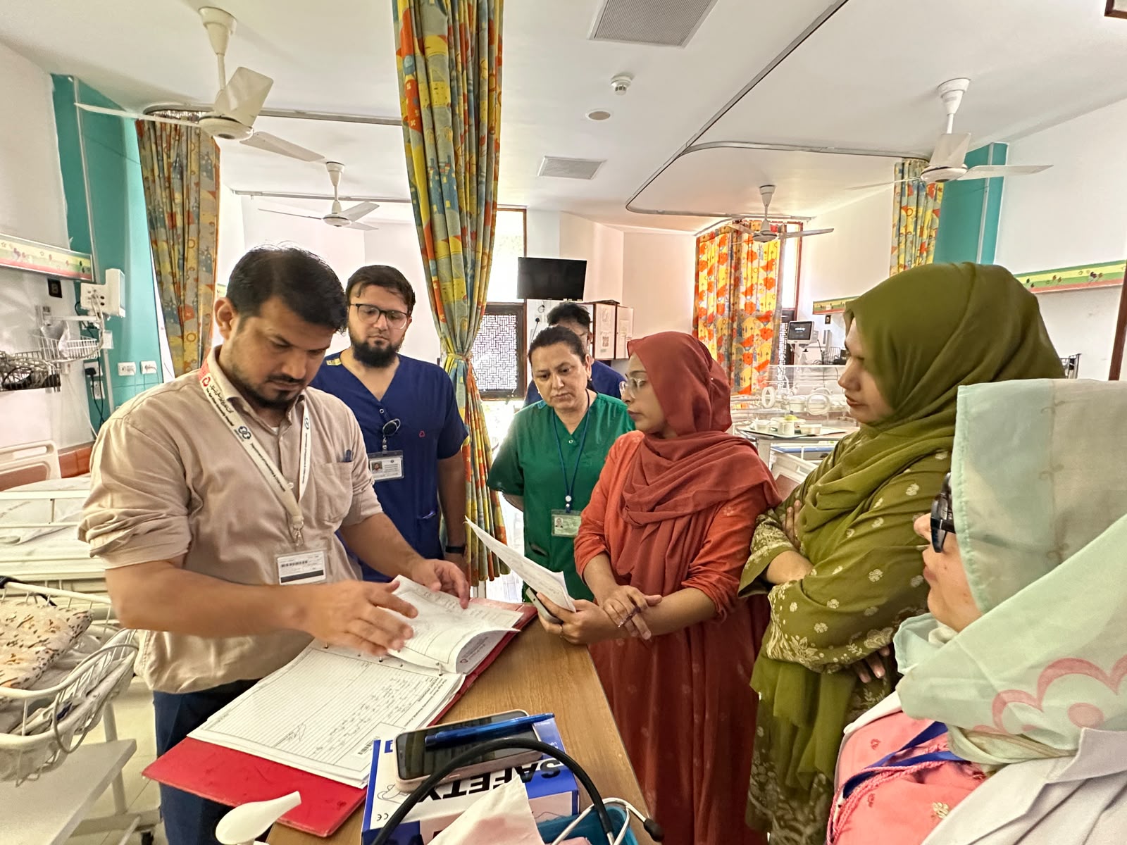 Clinicians review a patient chart