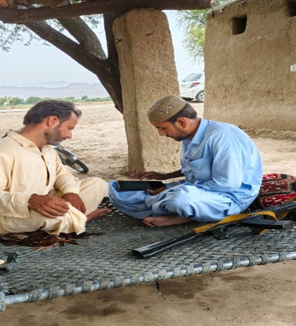 Enumerator conducting an interview with a respondent, illustrating the current security context in the region.