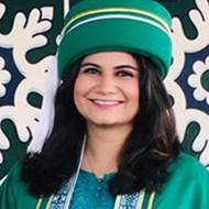 A person wearing a green hatDescription automatically generated with low confidence