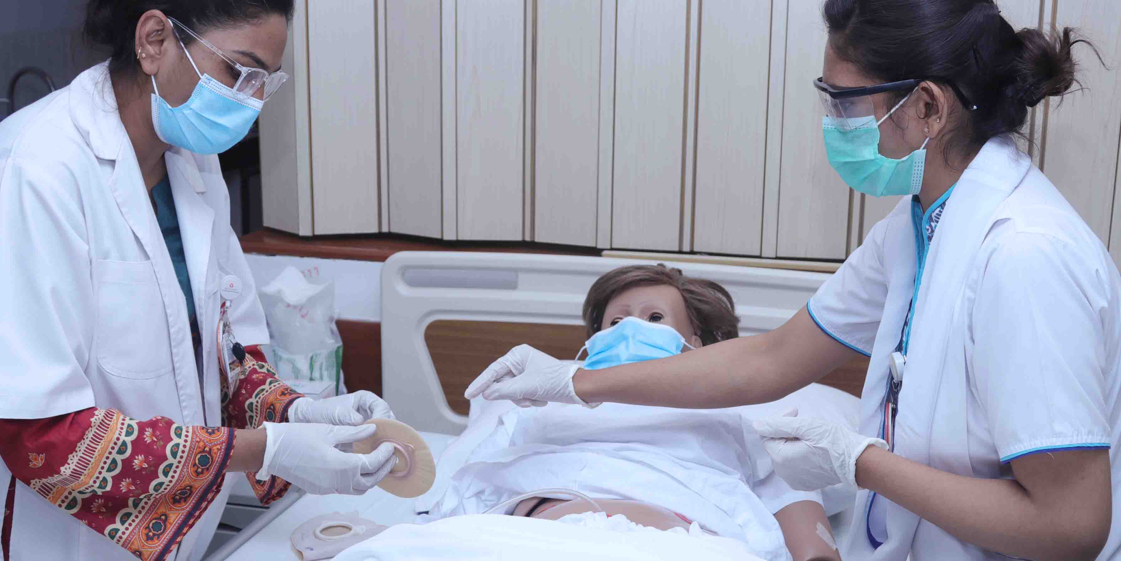 A doctor attending to a patient
Description automatically generated with low confidence